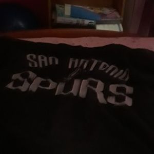 Plaid shirt, pink dress, and a spurs shirt